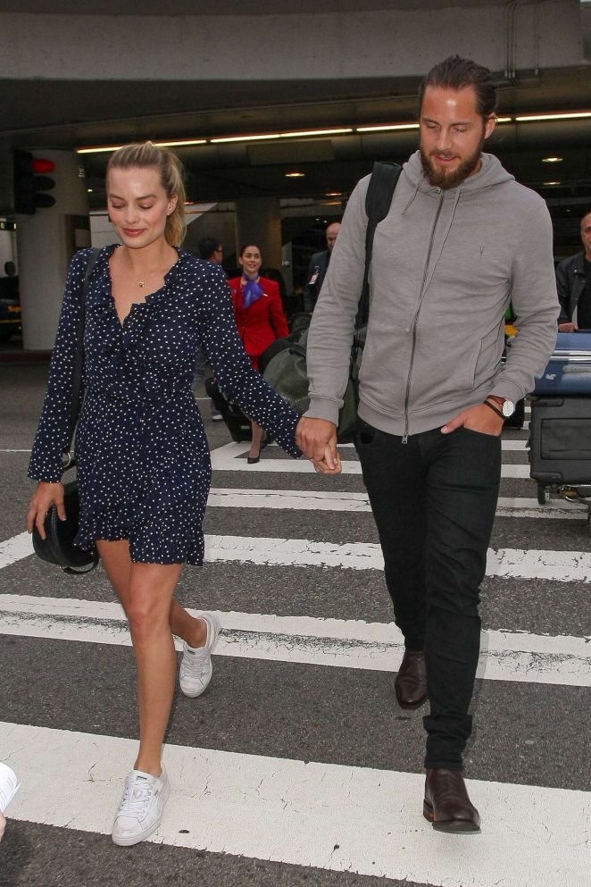 Margot Robbie With Tom Ackerley Arrives at LAX Airport in Los Angeles