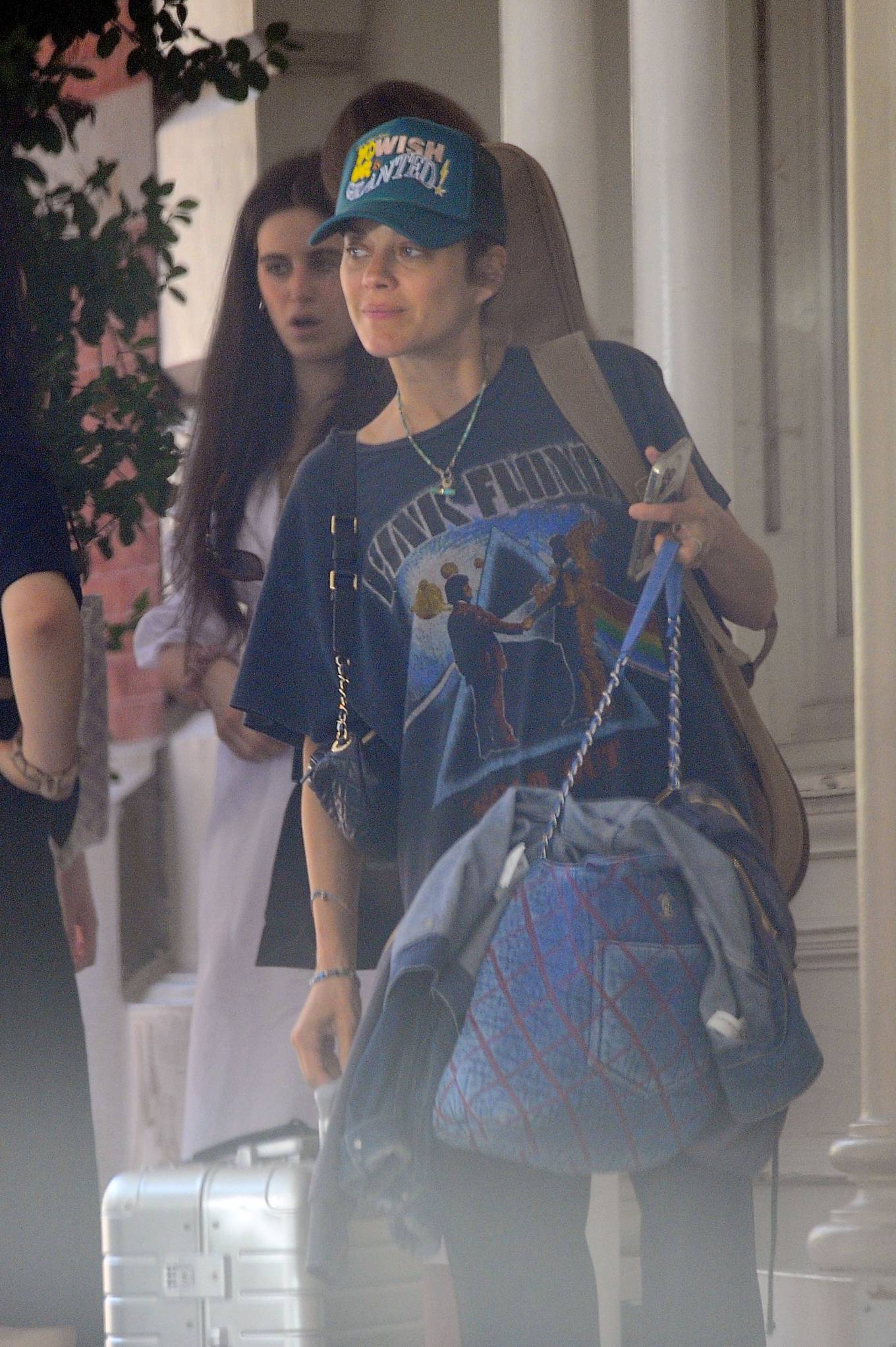 Marion Cotillard 2022 : Marion Cotillard – Wearing a Pink Floyd t-shirt heading to the airport in New York-04