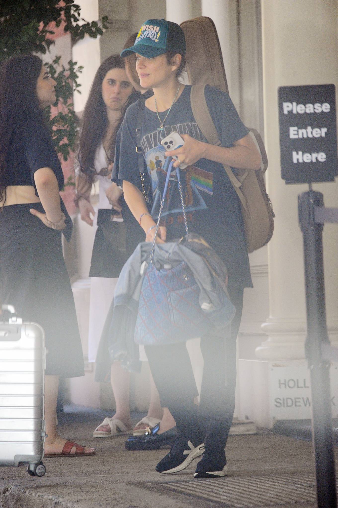 Marion Cotillard 2022 : Marion Cotillard – Wearing a Pink Floyd t-shirt heading to the airport in New York-05