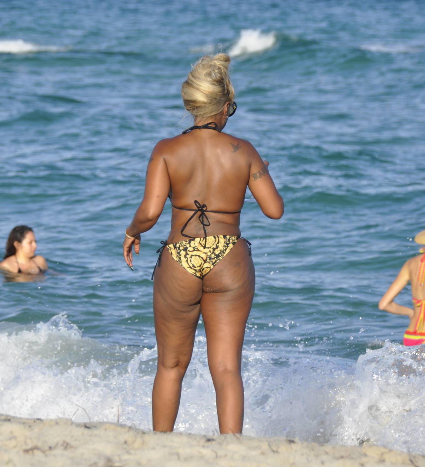 Mary J. Blige hits the beach in bejeweled blue bikini