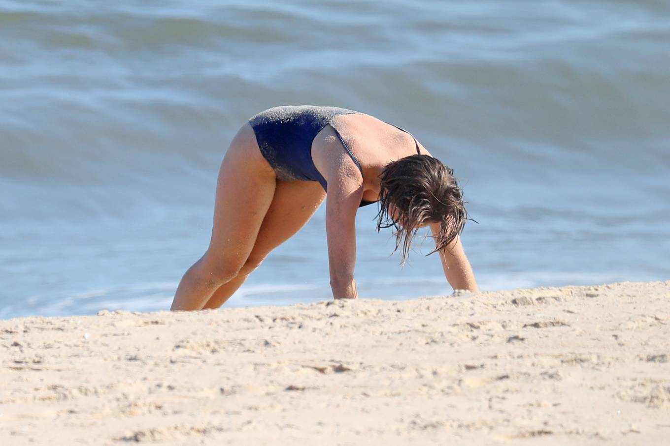 Maya Hawke - In blue bikini on the beach in the Hamptons. 