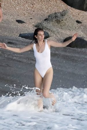 Maya Hawke - In white swimsuit jumping into the sea in St Barts