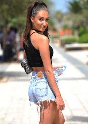 Megan Mckenna in Jeans Shorts on the beach in Majorca