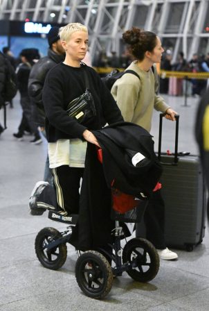 Megan Rapinoe - Seen with her partner Sue Bird arriving at JFK Airport in New York