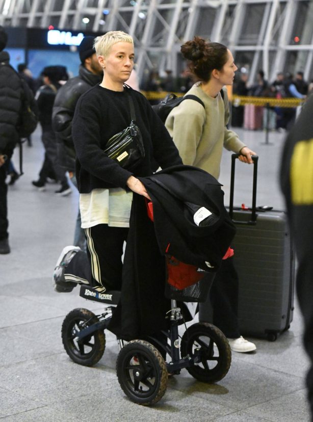 Megan Rapinoe - Seen with her partner Sue Bird arriving at JFK Airport in New York