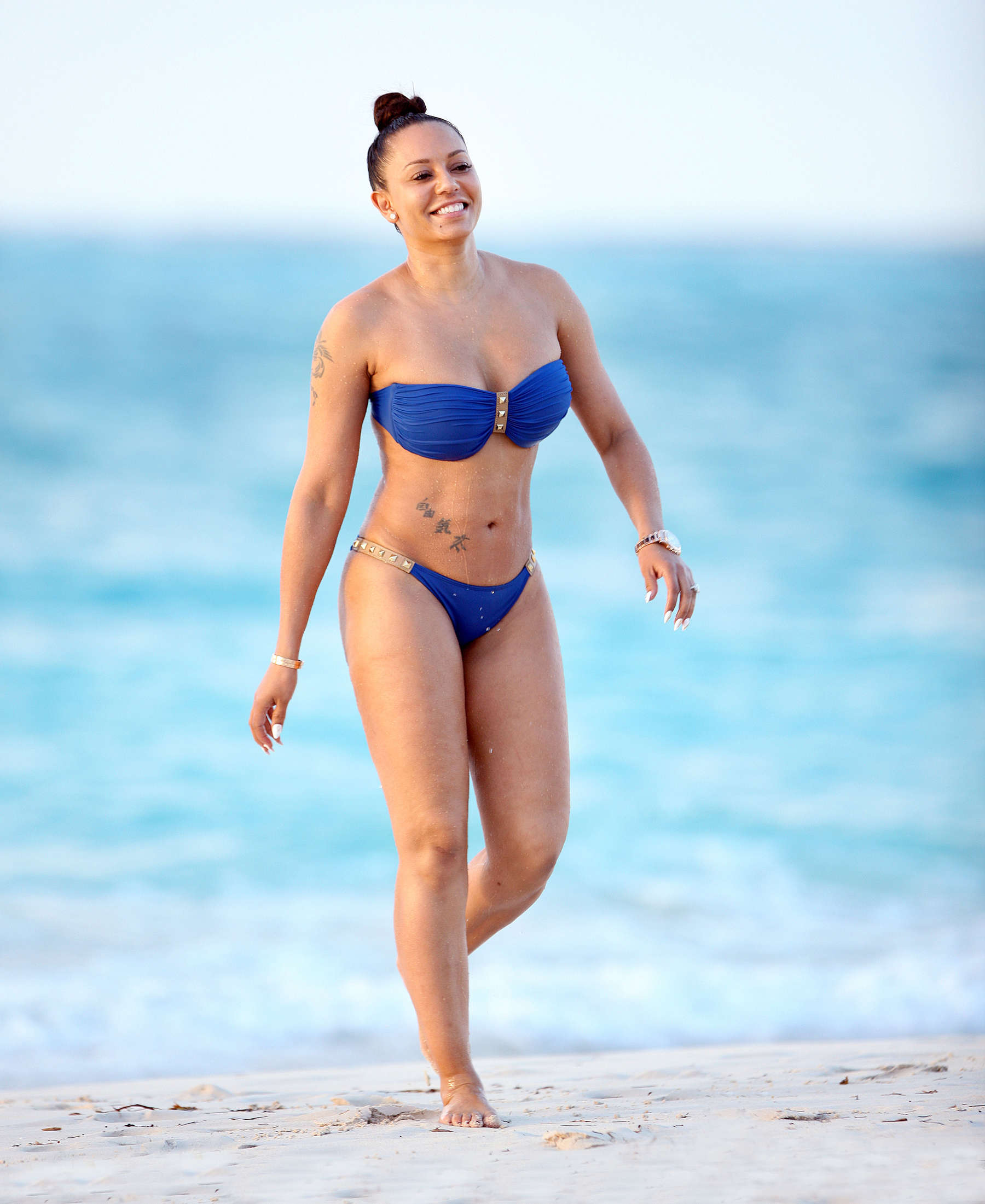 Melanie Brown - Bikini Candids at a beach in Turks & Caicos. 
