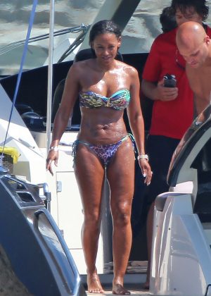 Melanie Brown in Bikini on the beach in Ibiza