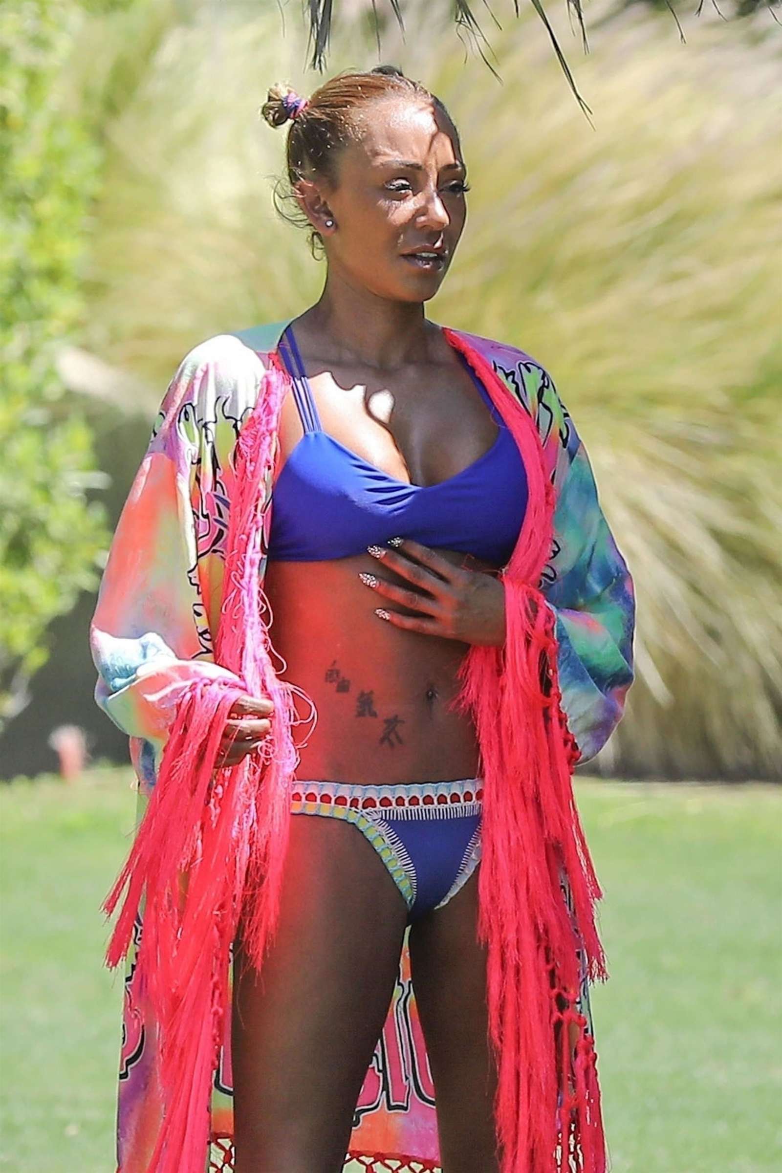 Melanie Brown in Blue Bikini on the pool in Palm Springs
