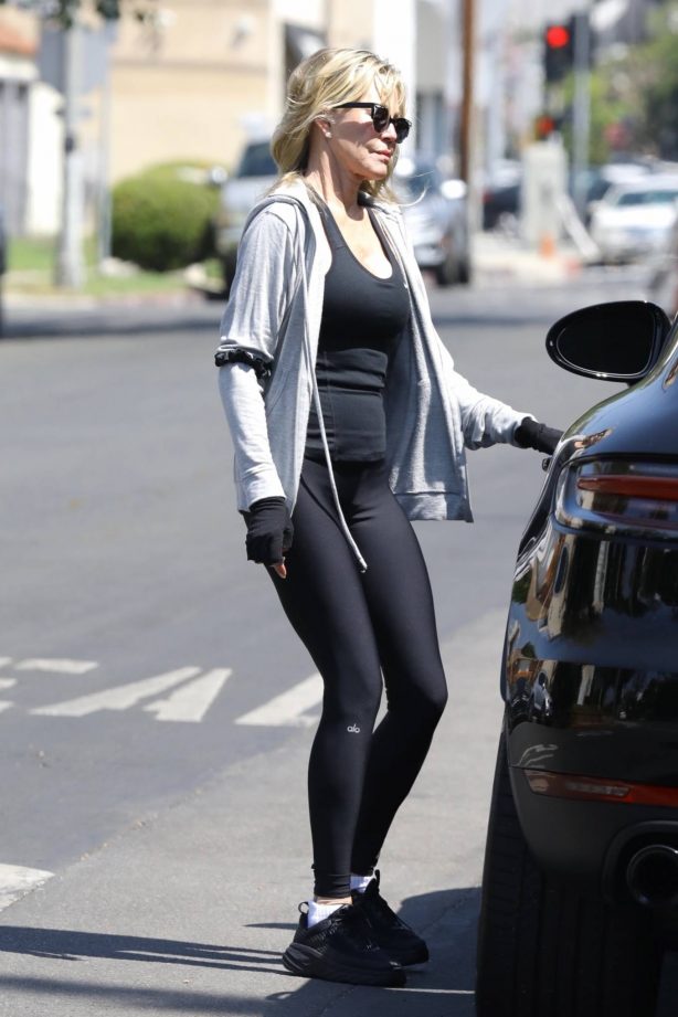 Melanie Griffith - In black Alo yoga seen running errand in Los Angeles