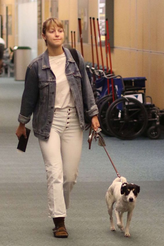 Melissa Benoist with her dog Farley at the airport in Vancouver
