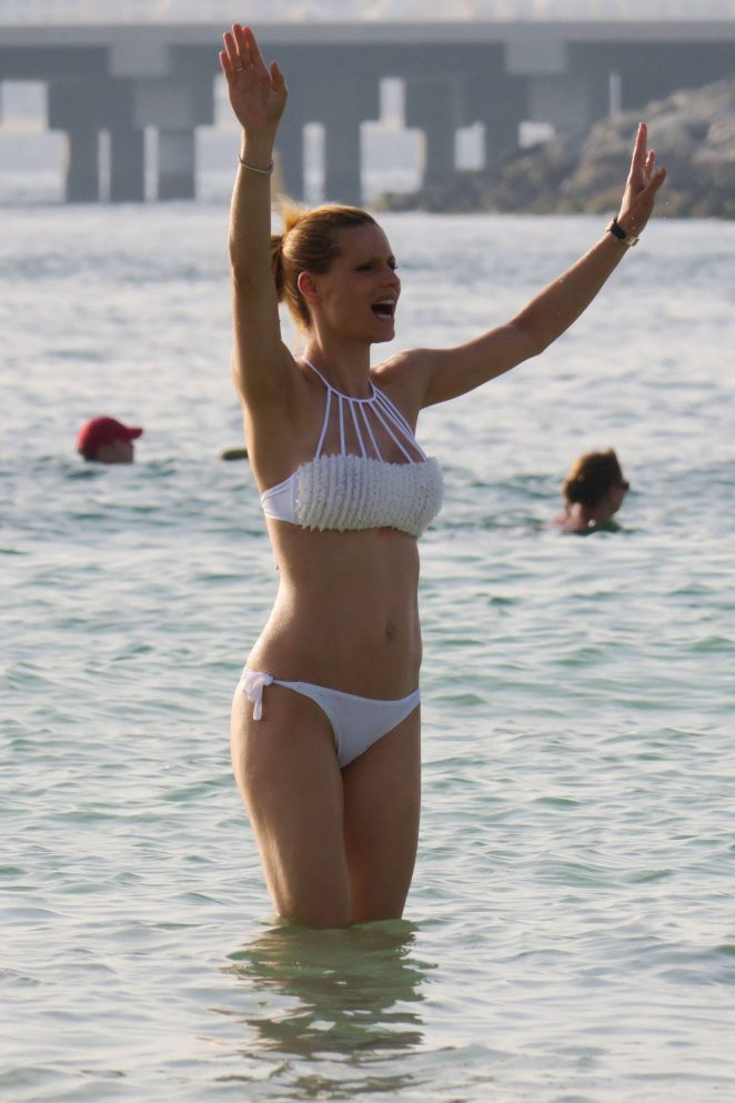 Michelle Hunziker in White Bikini on the beach in Dubai