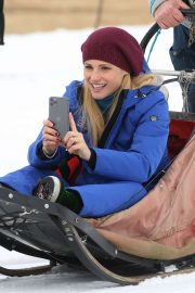 Michelle Hunziker on the dog sled in Sauris