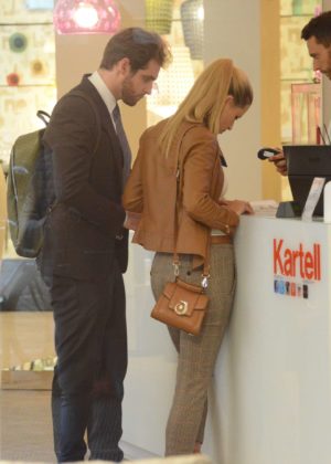 Michelle Hunziker with husband Tomaso Trussardi - Shopping Candids at Kartell in Milan