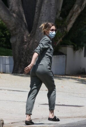 Michelle Pfeiffer - In jumpsuit delivered a letter offering to buy a house in Brentwood