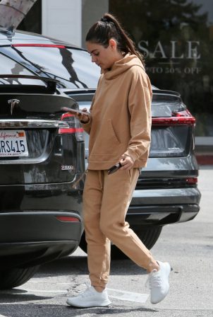 Mila Kunis - Seen In sweats as she exits a breakfast in Los Angeles