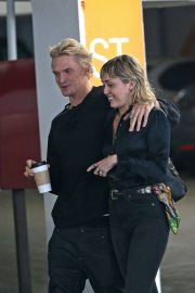 Miley Cyrus and Cody Simpson - Leaving Cedar Sinai hospital in Los Angeles