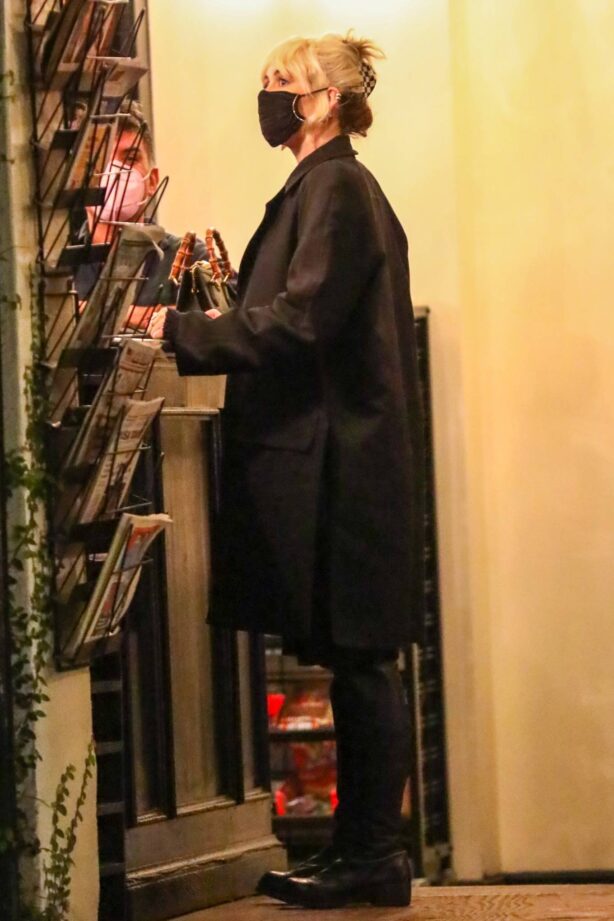 Miley Cyrus - Checks herself out on the cover of a magazine in Los Angeles