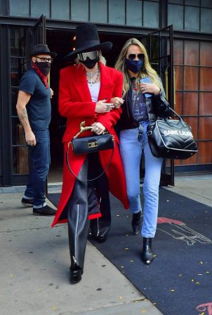 Miley Cyrus - In a red trench coat and black leather pants out in New York