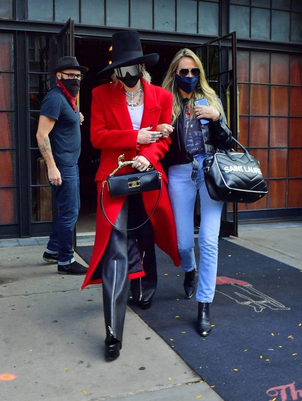 Miley Cyrus - In a red trench coat and black leather pants out in New York