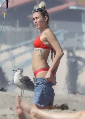 Miley Cyrus in Red Bikini and Liam Hemsworth at the beach in Malibu