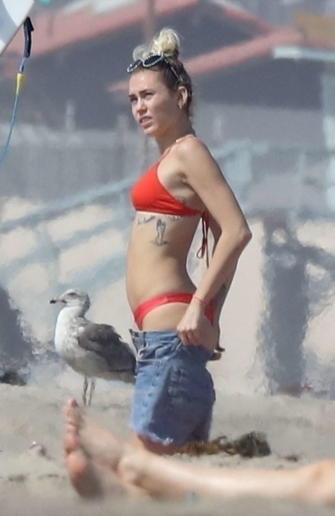 Miley Cyrus in Red Bikini and Liam Hemsworth at the beach in Malibu