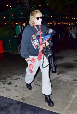 Miley Cyrus - With her mother Tish arrive at JFK Airport in New York
