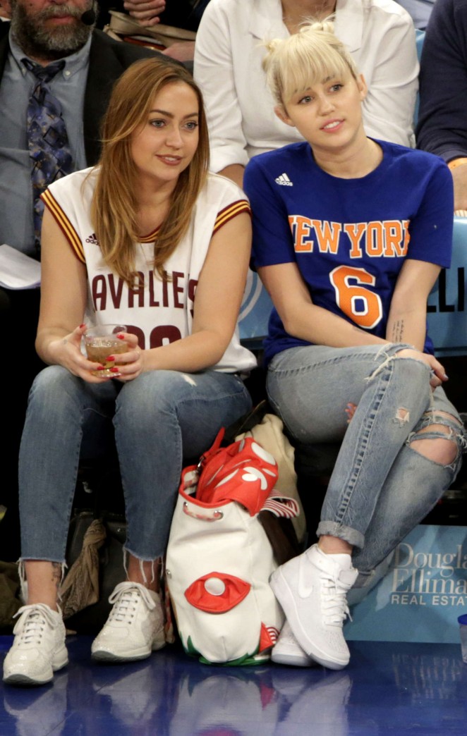 Miley Cyrus with sister Brandi at the Knicks game in NY
