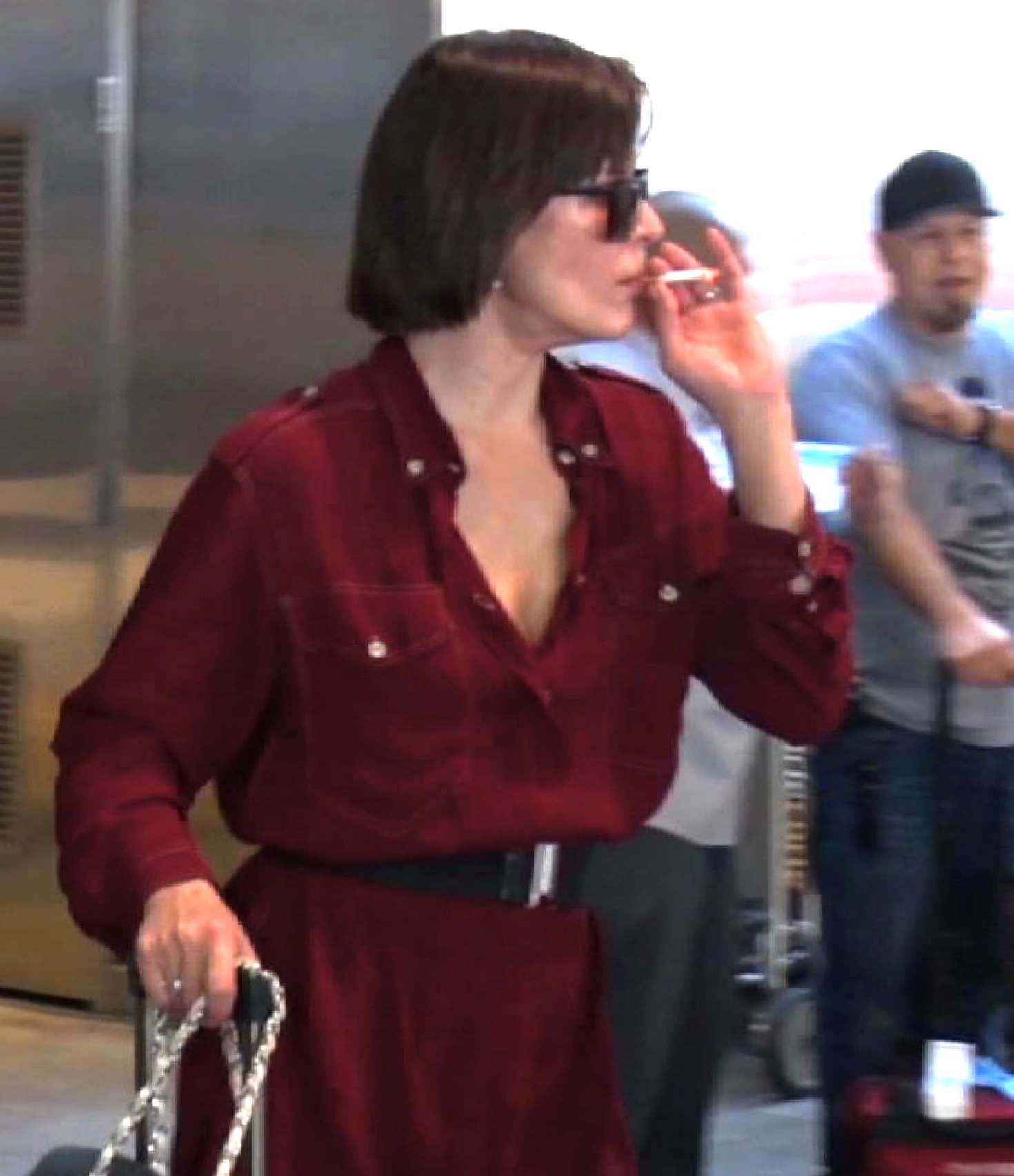 Milla Jovovich 2017 : Milla Jovovich in Red Dress at LAX Airport -03. 