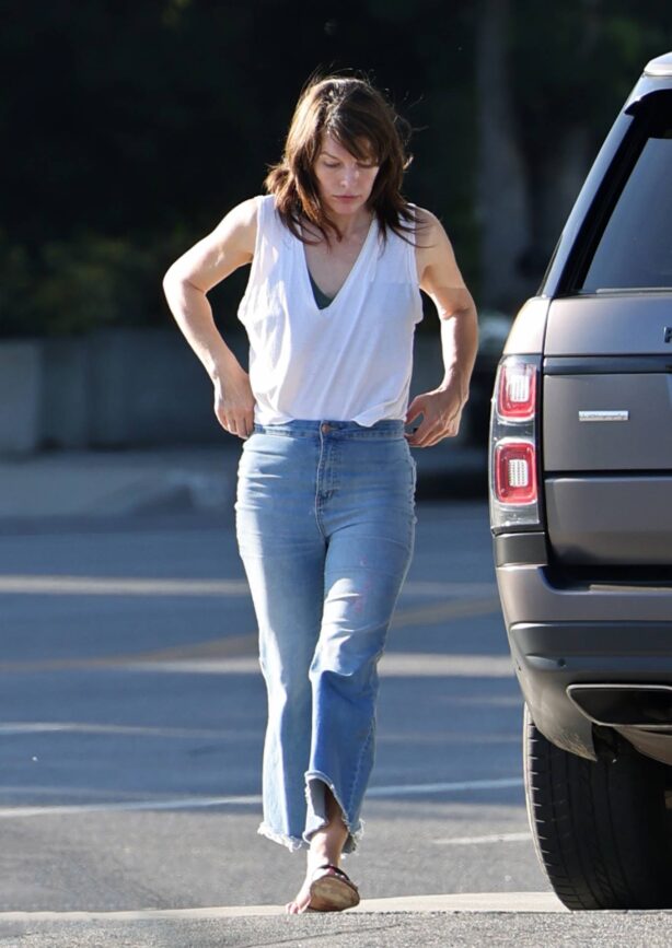 Milla Jovovich - Pumping gas into her $145k Range Rover Autobiography on Sunset Blvd