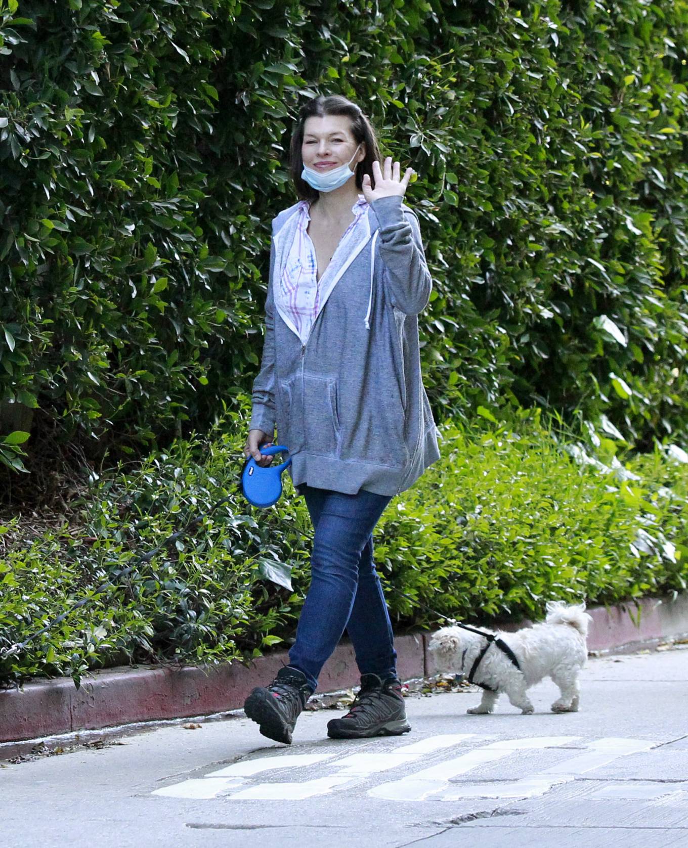 Milla Jovovich - Walking her dogs in Beverly Hills