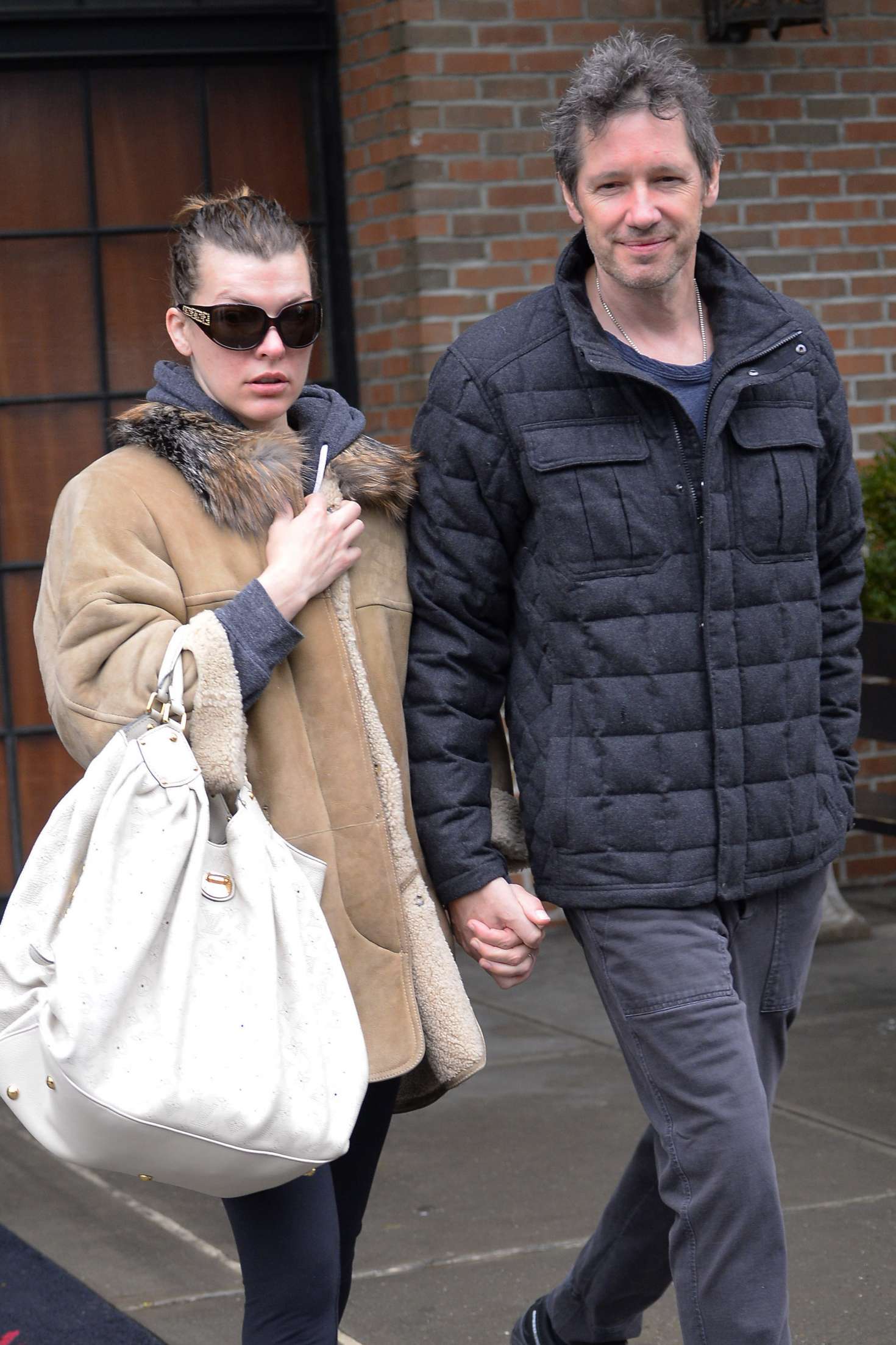 Milla Jovovich with husband - Leaves the Bowery Hotel in New York City