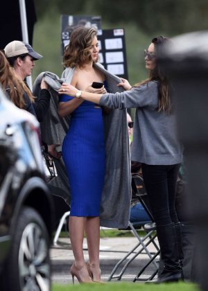 Miranda Kerr in a tight blue dress filming in LA