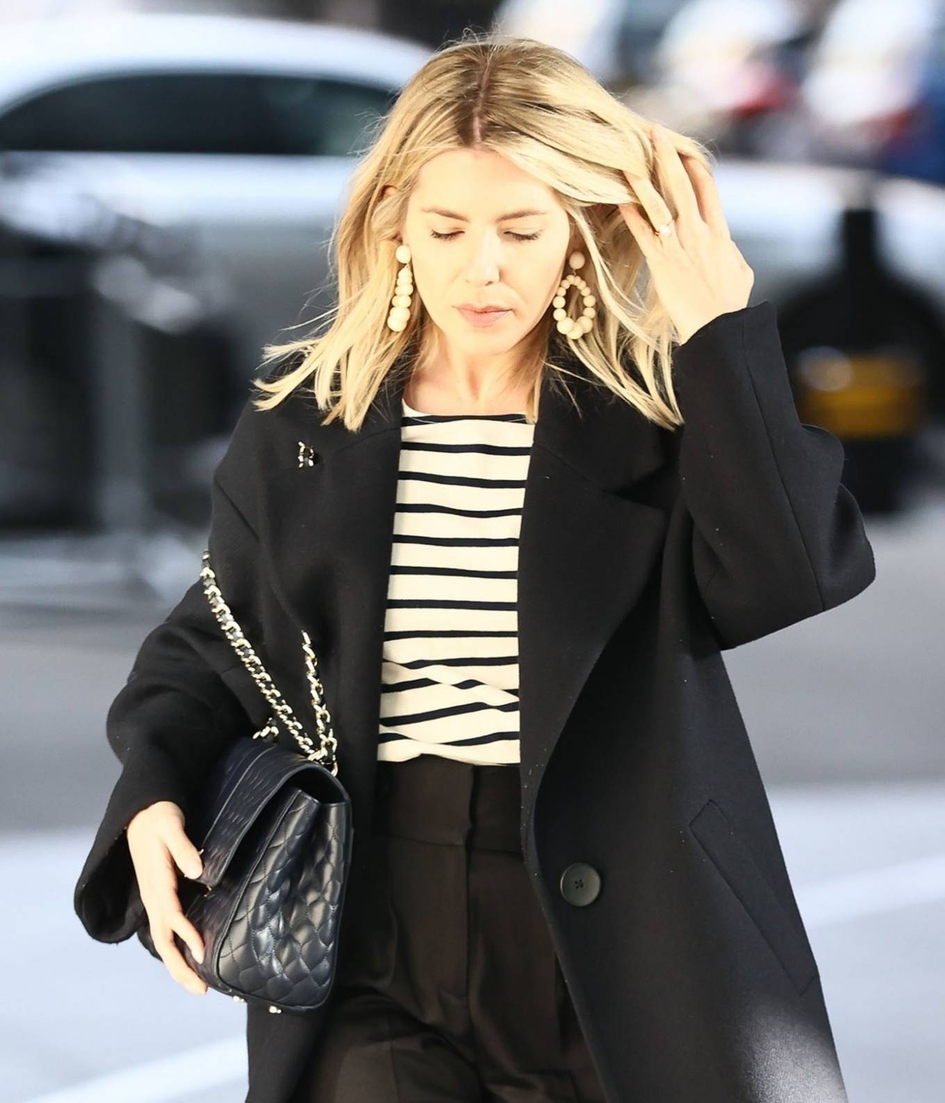 Mollie King – In a black coat at the BBC Radio One Studios in London