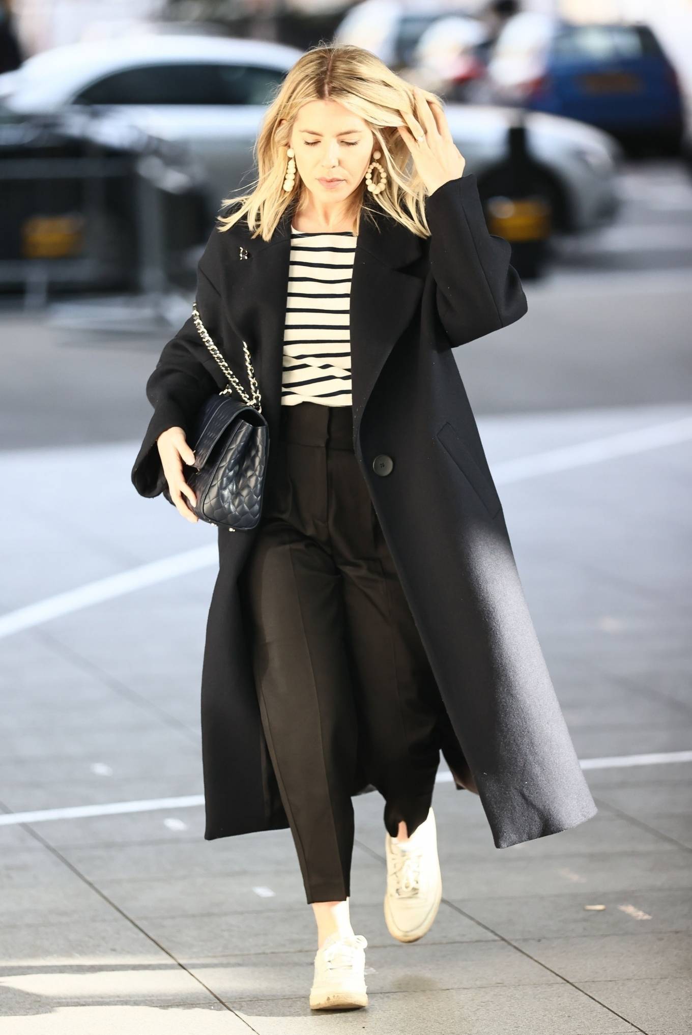 Mollie King – In a black coat at the BBC Radio One Studios in London