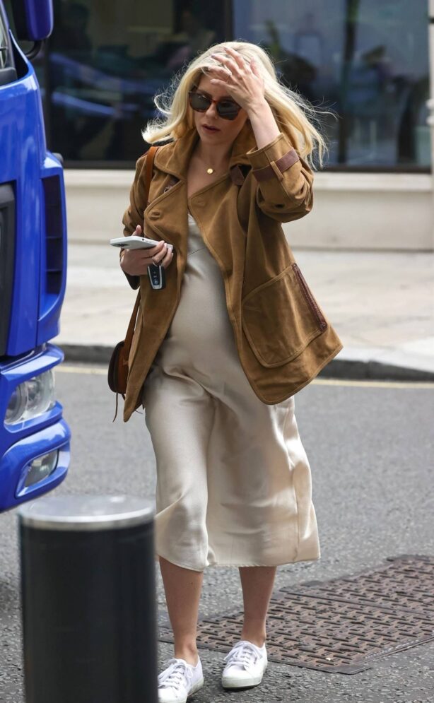 Mollie King looks - Showing off her growing baby bump at the BBC studio in London