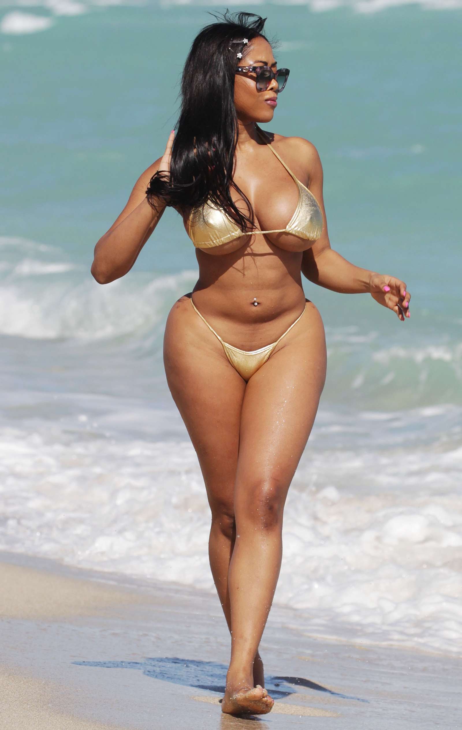Moriah Mills in Gold Bikini at the beach in Miami. 