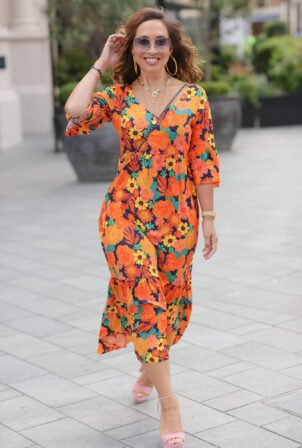 Myleene Klass - In a summer floral orange dress in London