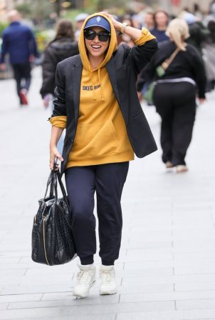 Myleene Klass - Wear a mustard yellow hoodie and tracksuit bottoms in London