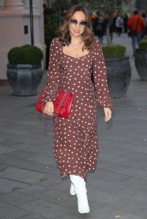 Myleene Klass - Wearing a polka dot dress and knee high boots at Smooth radio in London