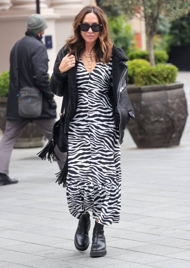 Myleene Klass - Wearing a zebra print dress and chunky boots in London