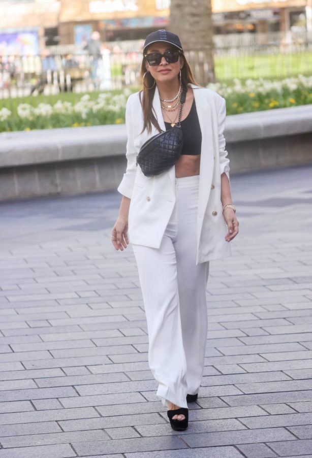 Myleene Klass - Wearing white trouser suit and crop top in London