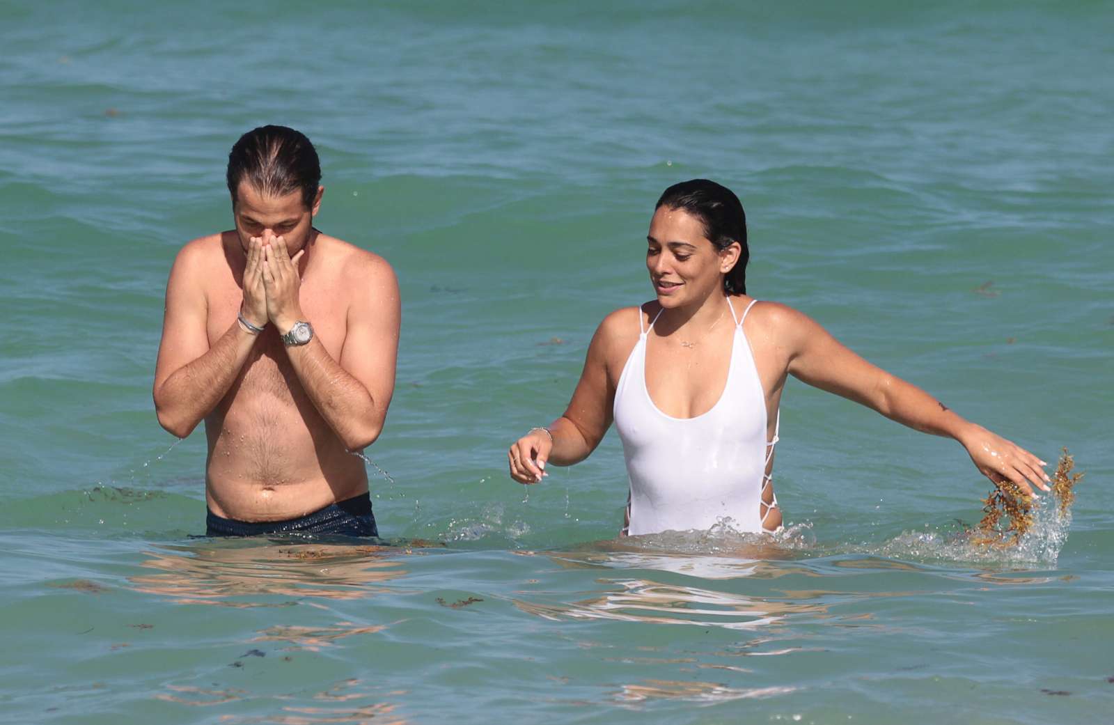 Natalie Martinez in White Swimsuit on the beach in Miami. 
