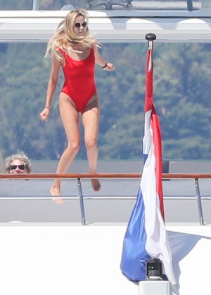 Natasha Poly in Red Swimsuit on a Yacht in Antibes