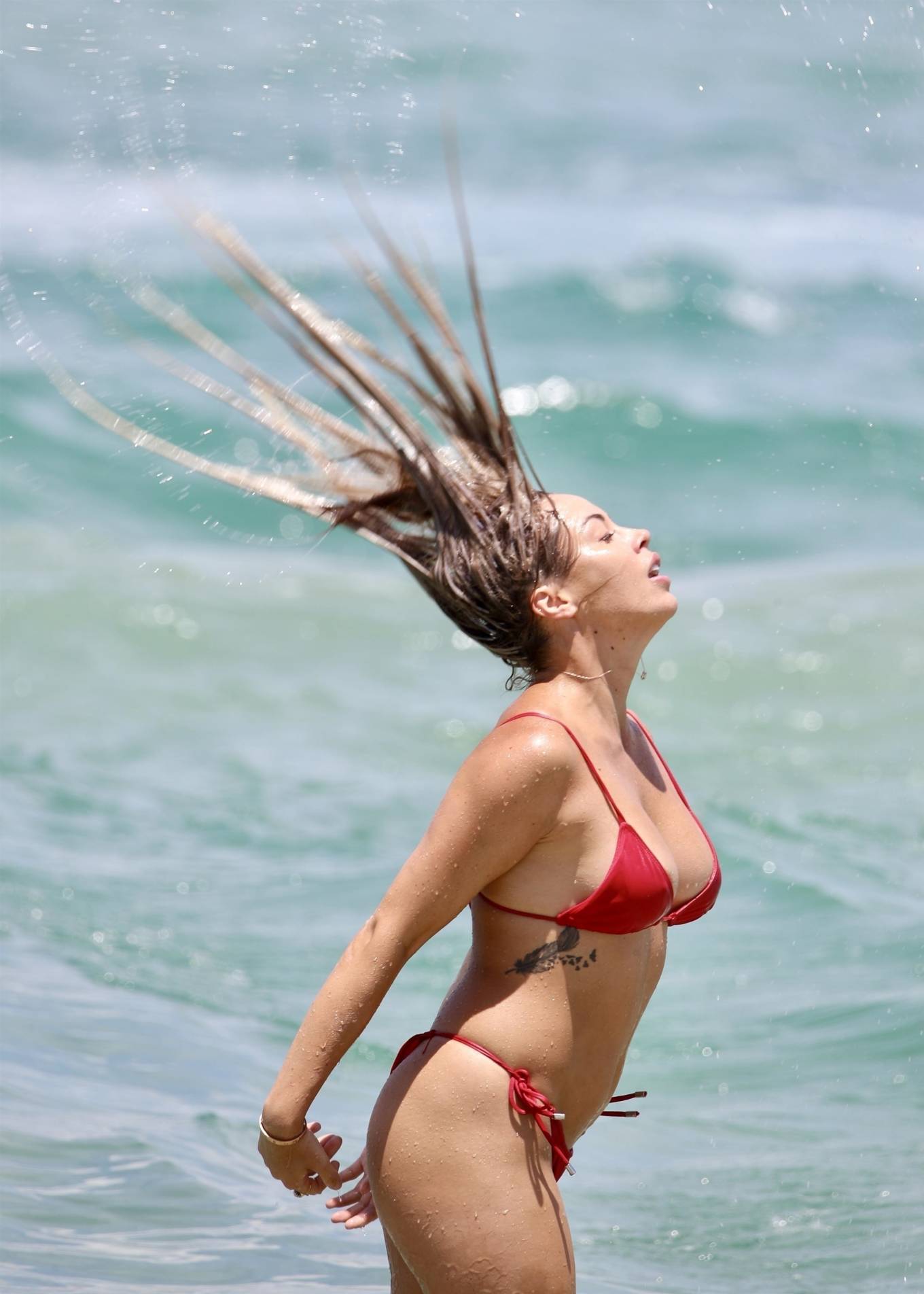 Natasha Spencer – In a red bikini at a beach on the Gold Coast