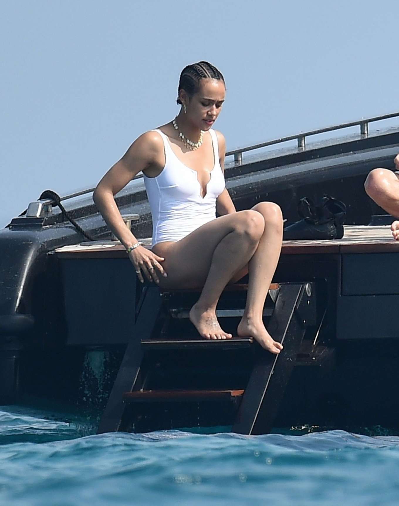 Nathalie Emmanuel - Spotted wearing a white swimsuit while on vacation in I...
