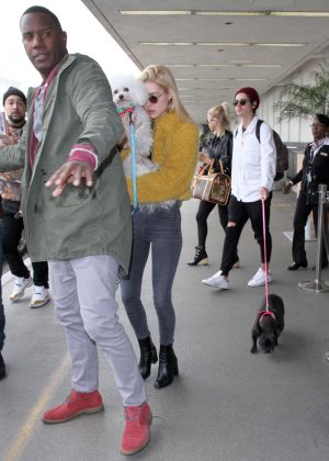 Nicola Peltz in Furry Yellow Jacket at LAX Airport in Los Angeles ...