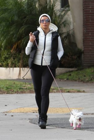 Nicole Murphy - Seen with her white pooch in Beverly Hills