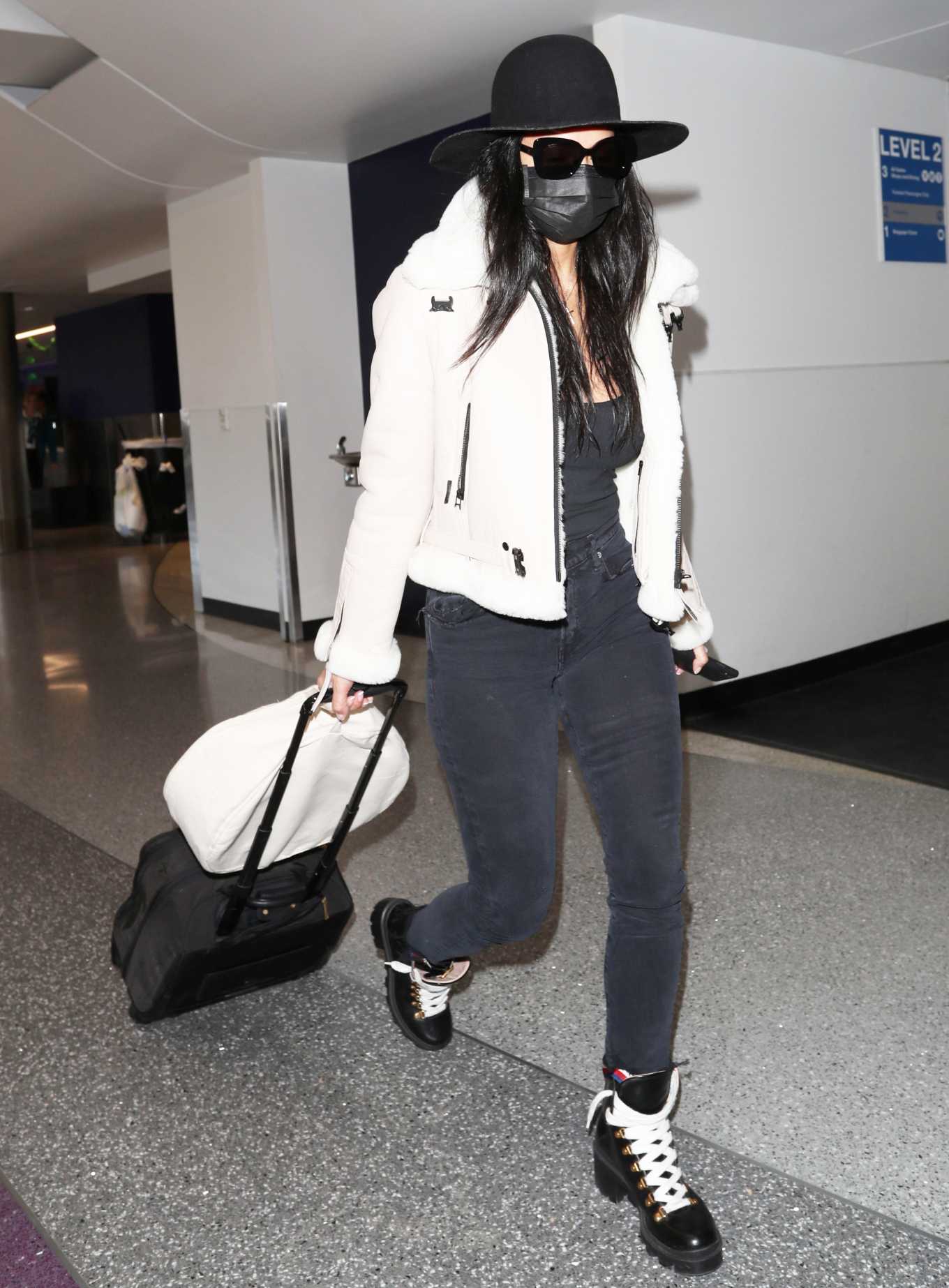 Nicole Scherzinger 2020 : Nicole Scherzinger – In a low-cut black tank top and skinny black shoes at LAX airport-03
