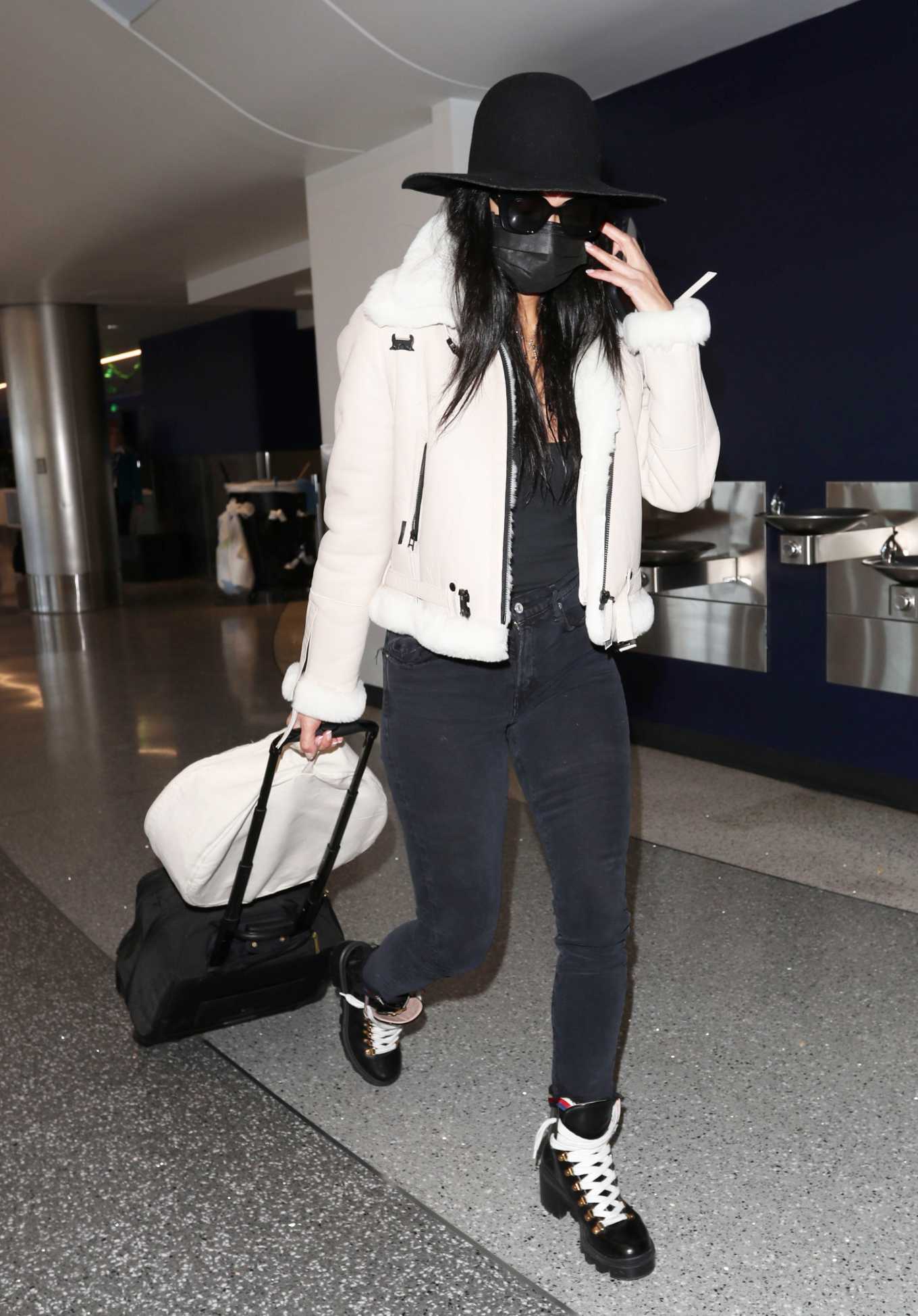 Nicole Scherzinger 2020 : Nicole Scherzinger – In a low-cut black tank top and skinny black shoes at LAX airport-12