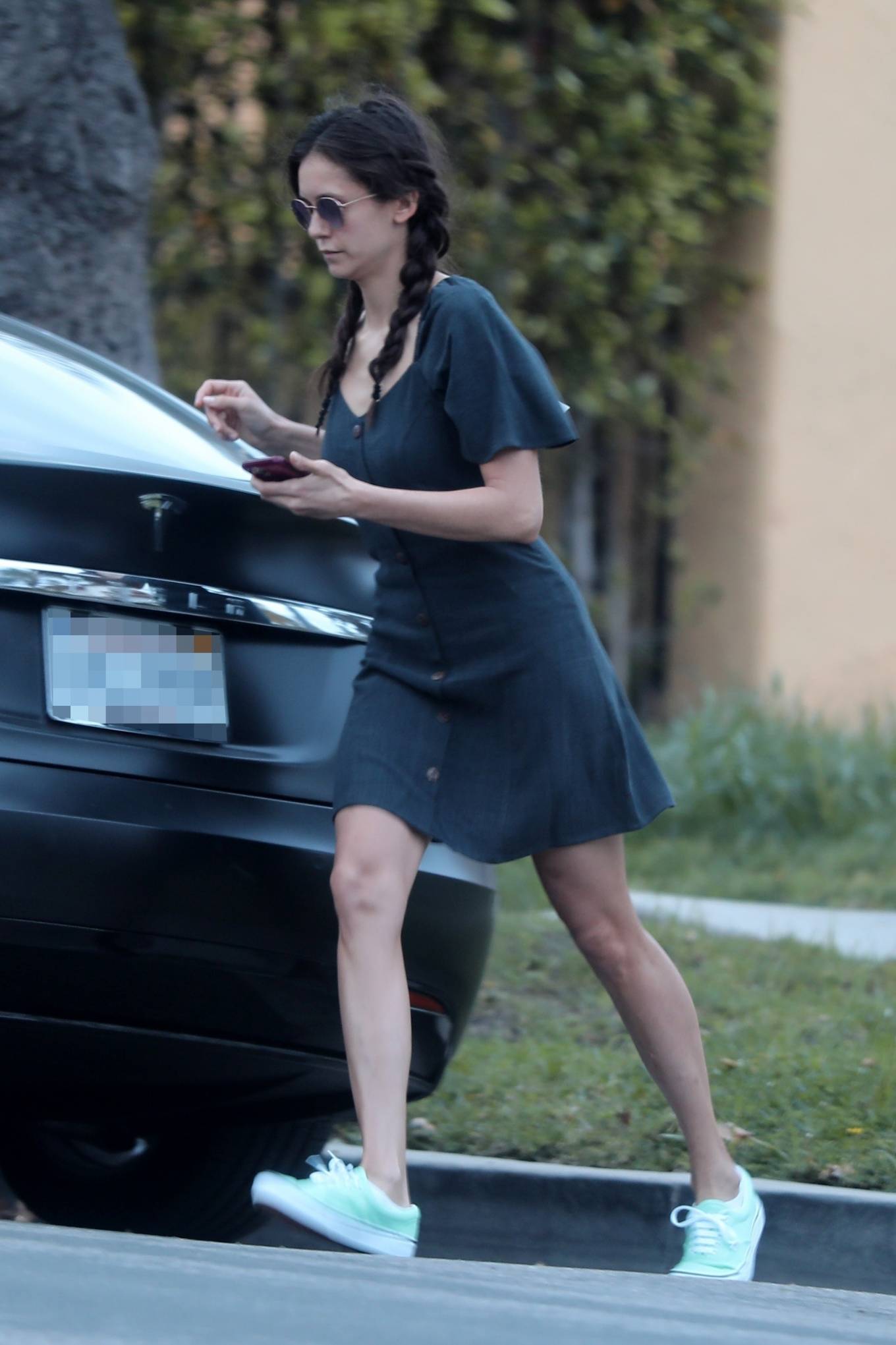 Nina Dobrev â€“ Forgets to remove the tag from her dress in West Hollywood